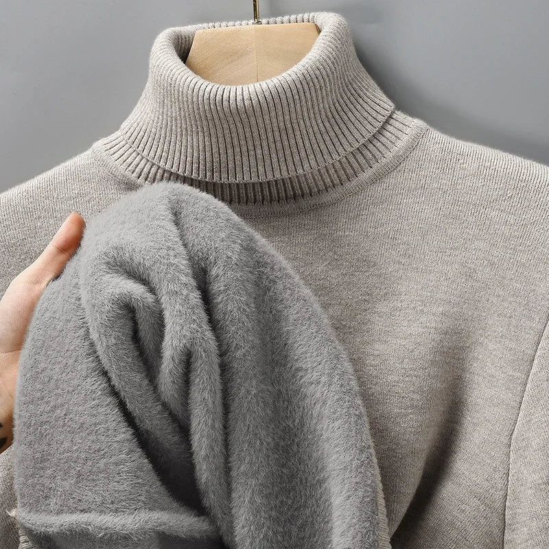 Merino rullekravesweater til herrer – nærbillede af ribbede manchetter