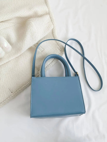Mini crossbody taske i lyserød denim – forfra