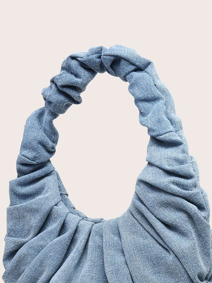 Grøn denim skuldertaske med retro udtryk og komfortabel skulderstrop