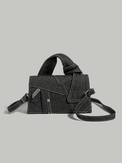 Denim skuldertaske i blå – front og remdetalje