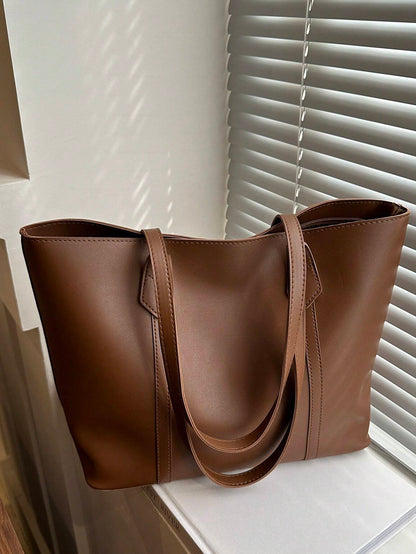 Stor elegant håndtaske til dame i minimalistisk design – set forfra