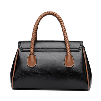 Håndtaske vist med skulderrem – elegant design