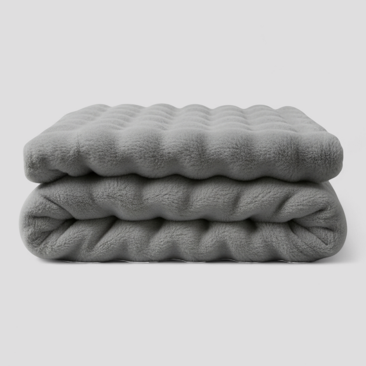 Fleece tæppe i hverdagsbrug – drapert over sofa